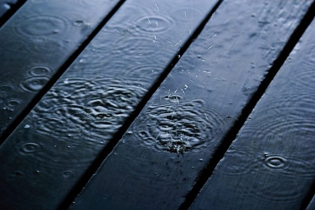 Rain on a wooden deck leading to expansion