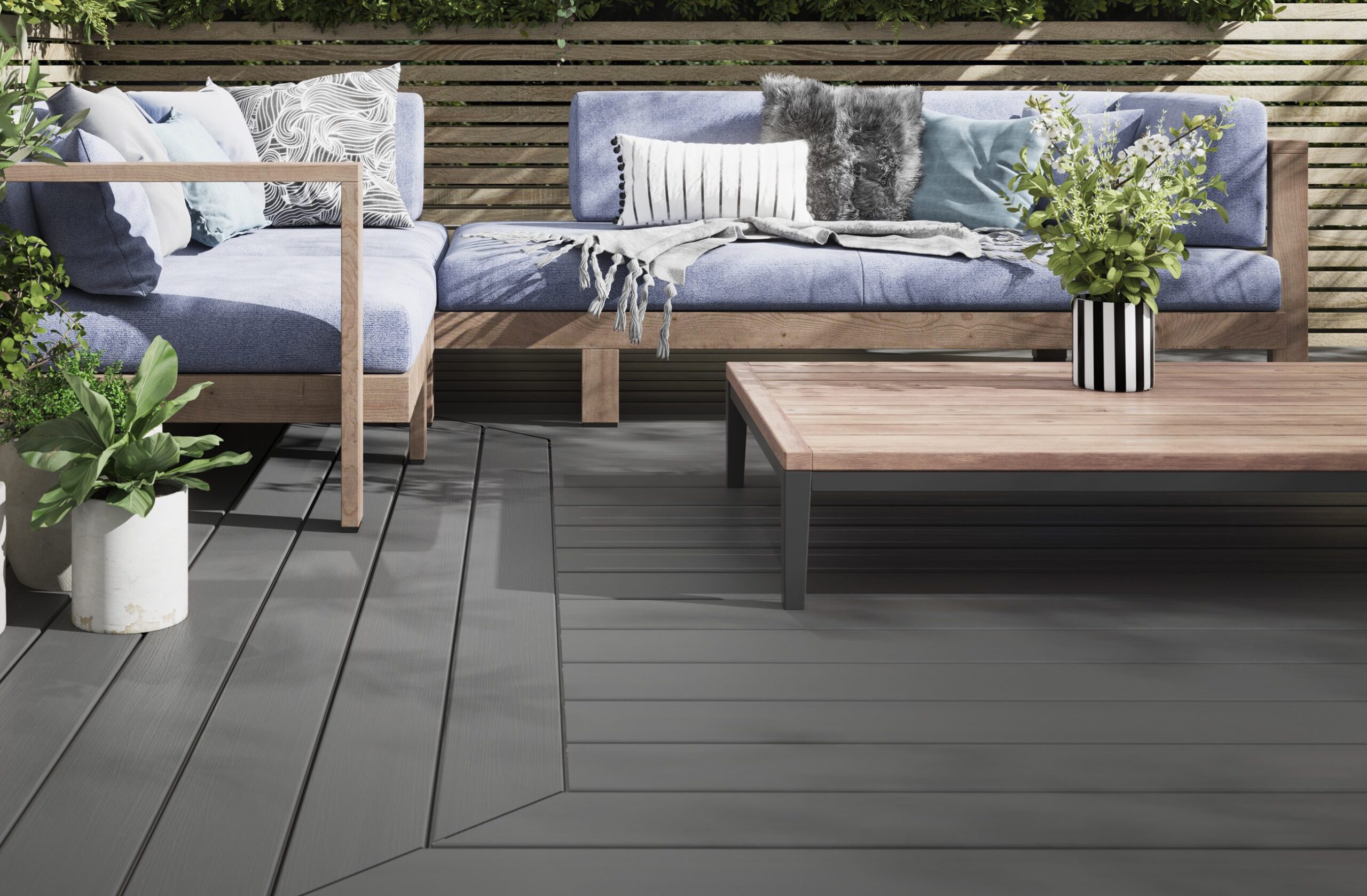 Evolution light grey capped composite decking in a seating setting
