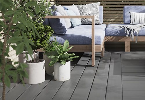 Evolution light grey capped composite decks in a seating setting close up