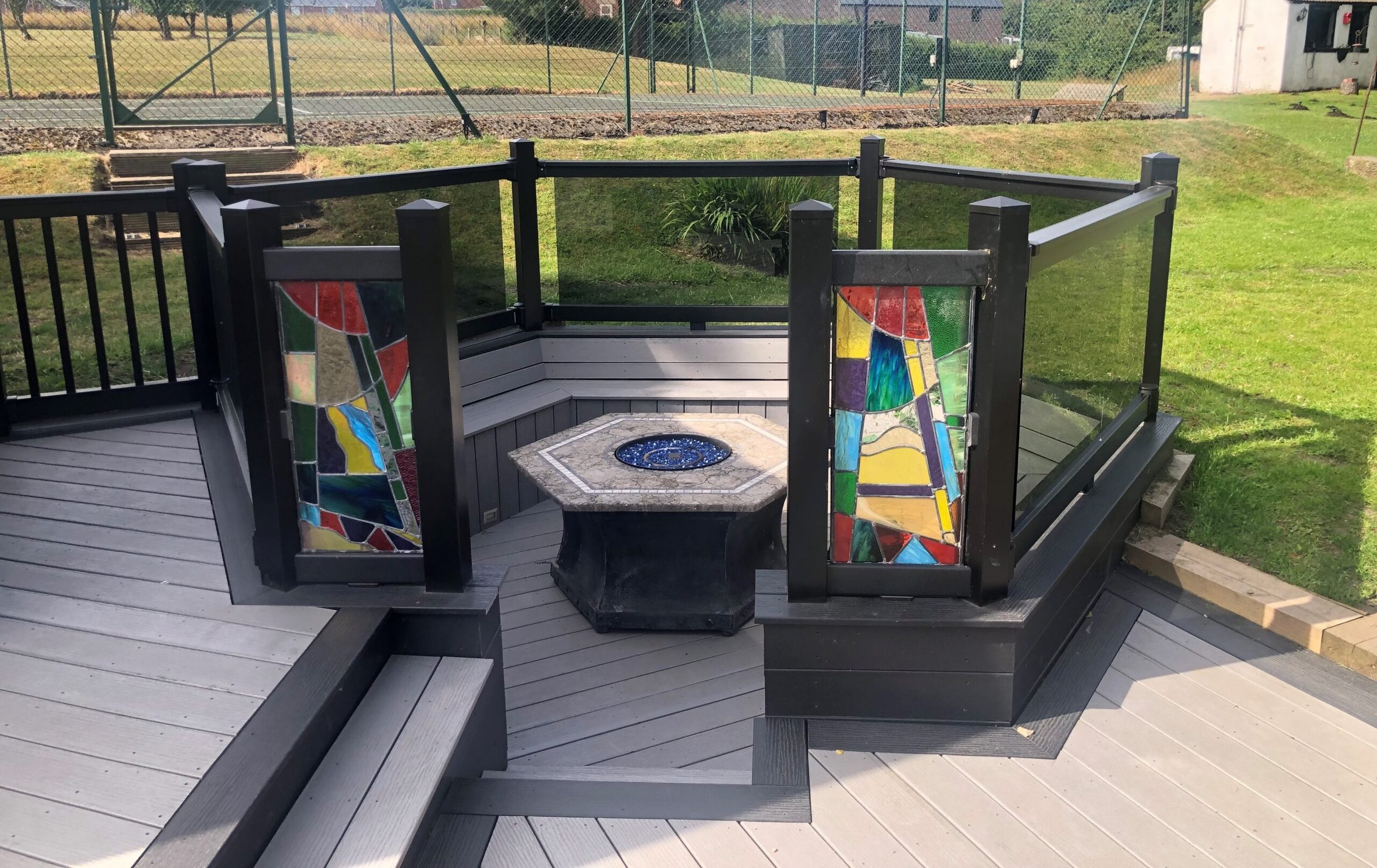Outdoor fire pit with composite decking