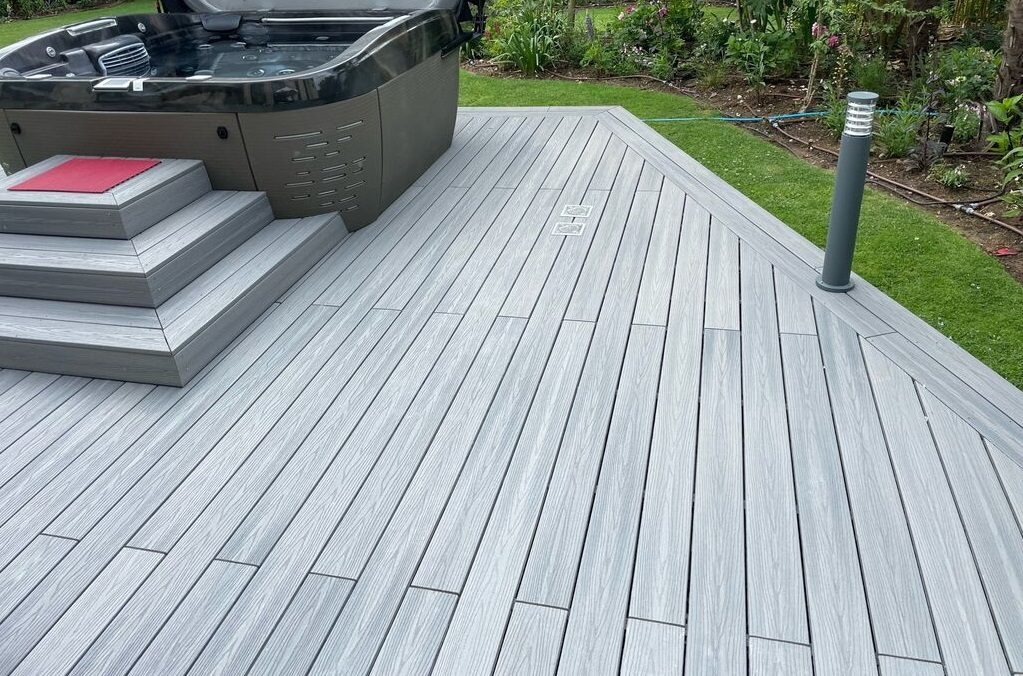 Composite decking surrounding a hot tub pool