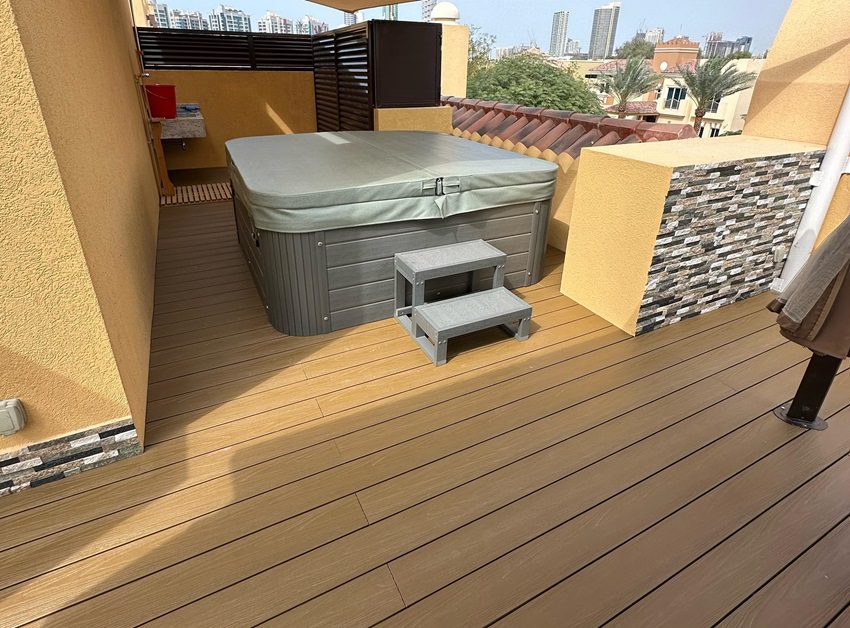 Hot tub with capped decking
